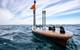 Wave Gliders float on the ocean’s surface. They are emission-free, propelled by wave energy, and solar powered. The glider collects oceanographic and weather data and can offload animal detection data from acoustic receivers without the need to bring them to the surface. © Nicolas Winkler