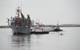 Tugs guide the Department of the Navy's Floating Instrument Platform (FLIP) from her berth at the Nimitz Marine Facility in Point Loma, Calif. (U.S. Navy photo by John F. Williams/Released)