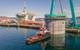 Hywind Tampen structures being floated out of the drydock at Stord, Norway. Photo from Aker Solutions / Lars Melkevik.