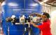 Irine Neba Neba Mforsoh performing an experiment in Professor Arun Shukla’s Dynamic Photomechanics Laboratory at URI. (Photo courtesy of Irine Neba Neba Mforsoh)