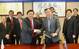 Wong Kok Seng (left), Managing Director (Offshore) of Keppel O&M and Managing Director of Keppel FELS signing the contract with Fan Qing Hua, Director of TS Offshore as management from Keppel and TS Offshore look on.