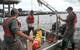 MBARI engineer Brian Kieft with researchers from the U.S. Geological Survey (USGS) on board the USGS vessel with the Tethys LRAUV, in the southern portion of Lake Michigan (Credit: Brett Hobson © 2016 MBARI)