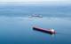The motor vessel Edgar B. Speer safely passes the safety zone around the motor vessel Roger Blough and responders near Gros Cap Reefs Light in Lake Superior, May 30, 2016. (U.S. Coast Guard photo by Christopher Yaw)