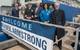 WHOI Vice President for Marine Operations Rob Munier presented Armstrong Captain Kent Sheasley and his crew with a framed photograph of Woods Hole, as a remembrance of home when they are at sea. (Photo by Jayne Doucette, WHOI)