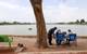 From left to right: UTEP doctoral student Jayanga Thanuka Samarasinghe, alumnus
Fernando Sotelo and Assistant Professor Laura Alvarez observe the boat from shore as it maps Ascarate Lake’s
underwater terrain. Credit: The University of Texas at El Paso.