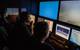 The science team in the E/V Nautilus control van monitor the dive and identify potential sampling targets. (Photo: Susan Poulton/OET)