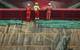 DOF subsea workers stand on the deck facing the hull of a massive DOF Subsea offshore vessel.  (Photo courtesy of DOF Subsea)