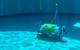 Testing the Square Robot vehicle in a test tank filled with water. The DVL1000, seen on the right, is mounted so it can work unobstructed, while maintaining a minimum distance from the floor. Image courtesy Nortek/Square Robot
