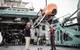 WHOI’s Tim Shank and Molly Curran position AUV Orpheus on deck for deployment operations. Image from Woods Hole Oceanographic Institution