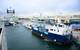 DYT Yacht Transport’s Yacht Express submerges in Port Everglades, Fla. to allow its cargo of yachts, including the 126-foot research vessel M/V OCEARCH (blue hull), to float on. OCEARCH is on its way to Brisbane, Australia. (photo credit Tom Serio Photography).